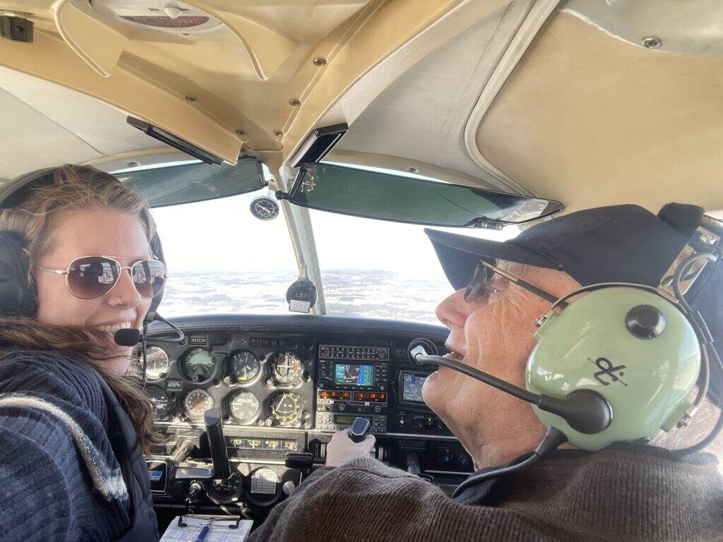 Nicholas Maxwell and his daughter in the airplane cockpit